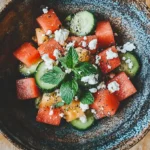 Simple watermelon cucumber feta salad served in a bowl
